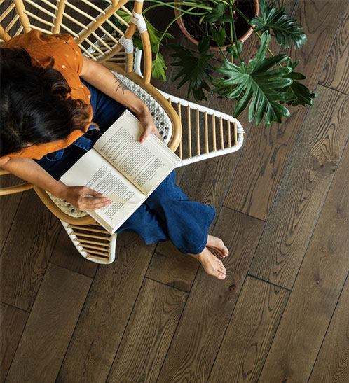 Lady reading book | Echo Flooring Gallery