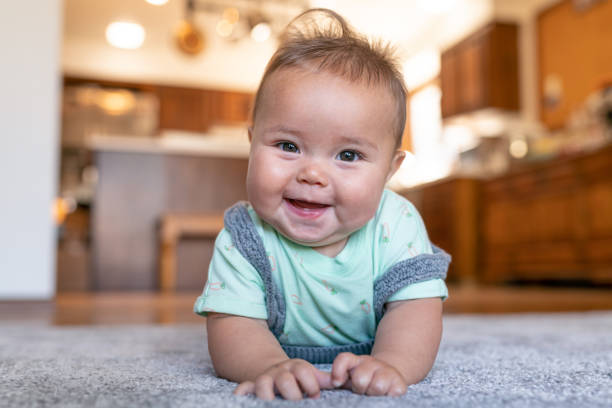 Baby lying on carpet | Echo Flooring Gallery